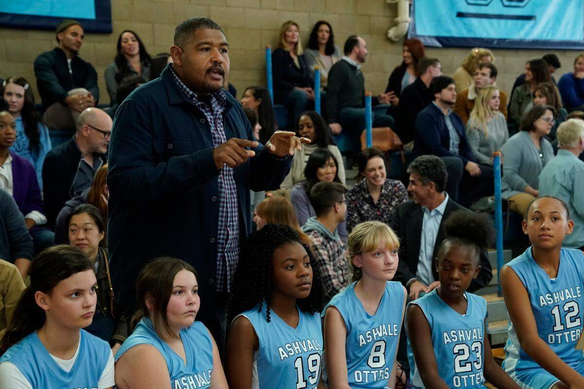 Using merchandise from the University of North Carolina at Chapel Hill has been prohibitively expensive for the CBS show “The Unicorn,” but the Ashvale Otters were able to adopt Carolina blue colors. Pictured here, Omar Benson Miller as Ben.
