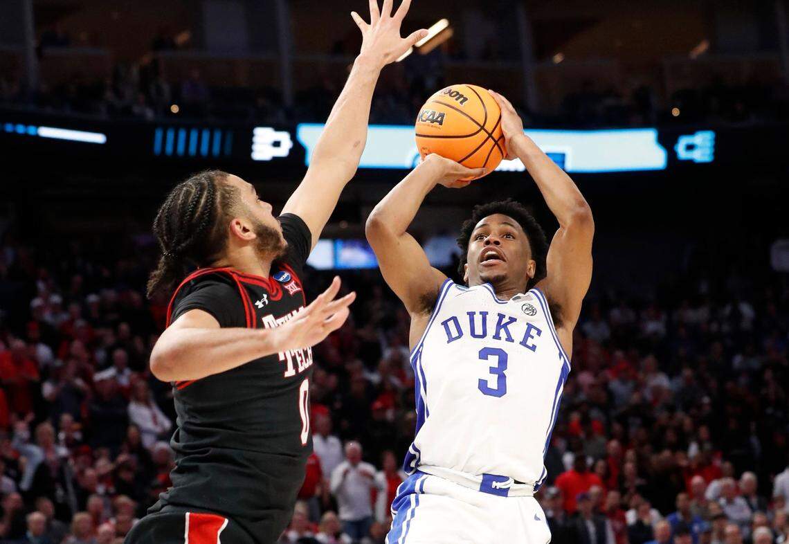 Dukes Jeremy Roach (3) shoots as Texas Tech’s Kevin Obanor (0) defends during the second half of Dukes 78-73 victory over Texas Tech in the Sweet 16 round of the NCAA Tournament at the Chase Center in San Francisco, Calif., Thursday, March 24, 2022.