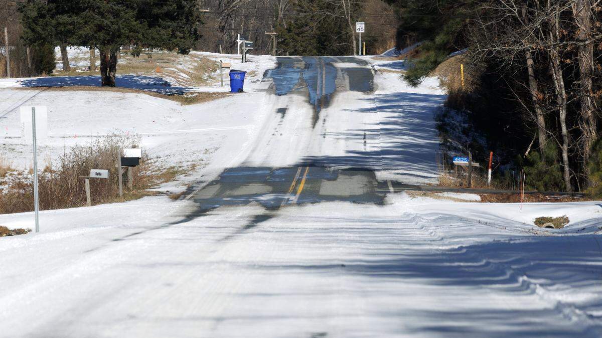 Snow and ice cover a portion of Kerley Road on Monday, Feb. 2, 2026, in Durham, N.C.