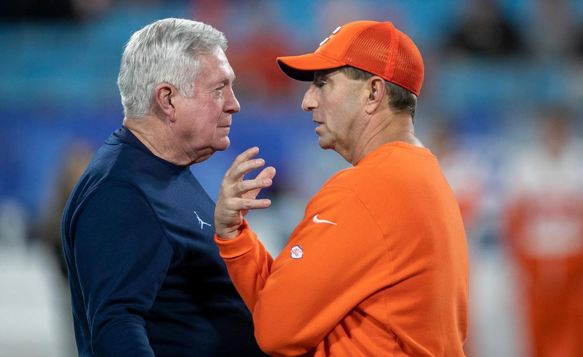 North Carolina coach Mack Brown talks with Clemson coach Dabo Swinney prior to the ACC Championship game on Saturday, December 3, 2022 at Bank of American Stadium in Charlotte, N.C.