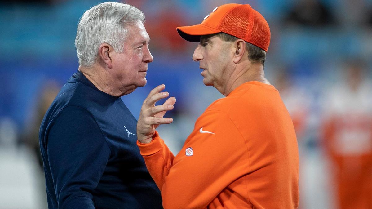 North Carolina coach Mack Brown talks with Clemson coach Dabo Swinney prior to the ACC Championship game on Saturday, December 3, 2022 at Bank of American Stadium in Charlotte, N.C.