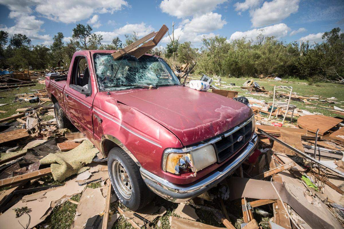 A damaged truck sits amongst rubble caused by a suspected tornado that resulted from Isaias in the early morning hours of Tuesday, Aug. 4, 2020. The storm ripped through the area southeast of Windsor, N.C. in Bertie County.