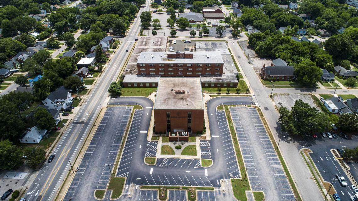 The former North Carolina Division of Motor Vehicles headquarters sits empty at the intersection Tarboro Street and New Bern Avenue east of downtown Raleigh June 11, 2021. After the headquarters was moved to Rocky Mount last fall, private developers and city leaders have expressed interest in the property.