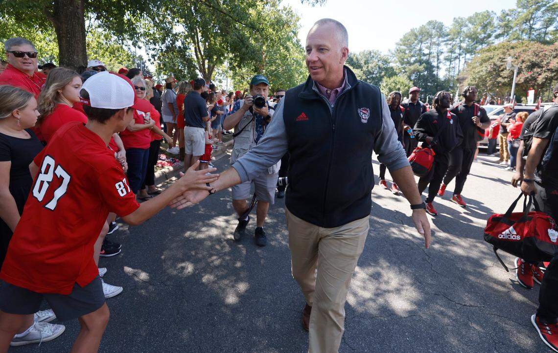 N.C. State head coach Dave Doeren greets fans during the Walk of Champions before N.C. State’s game against VMI at Carter-Finley Stadium in Raleigh, N.C., Saturday, Sept. 16, 2023.