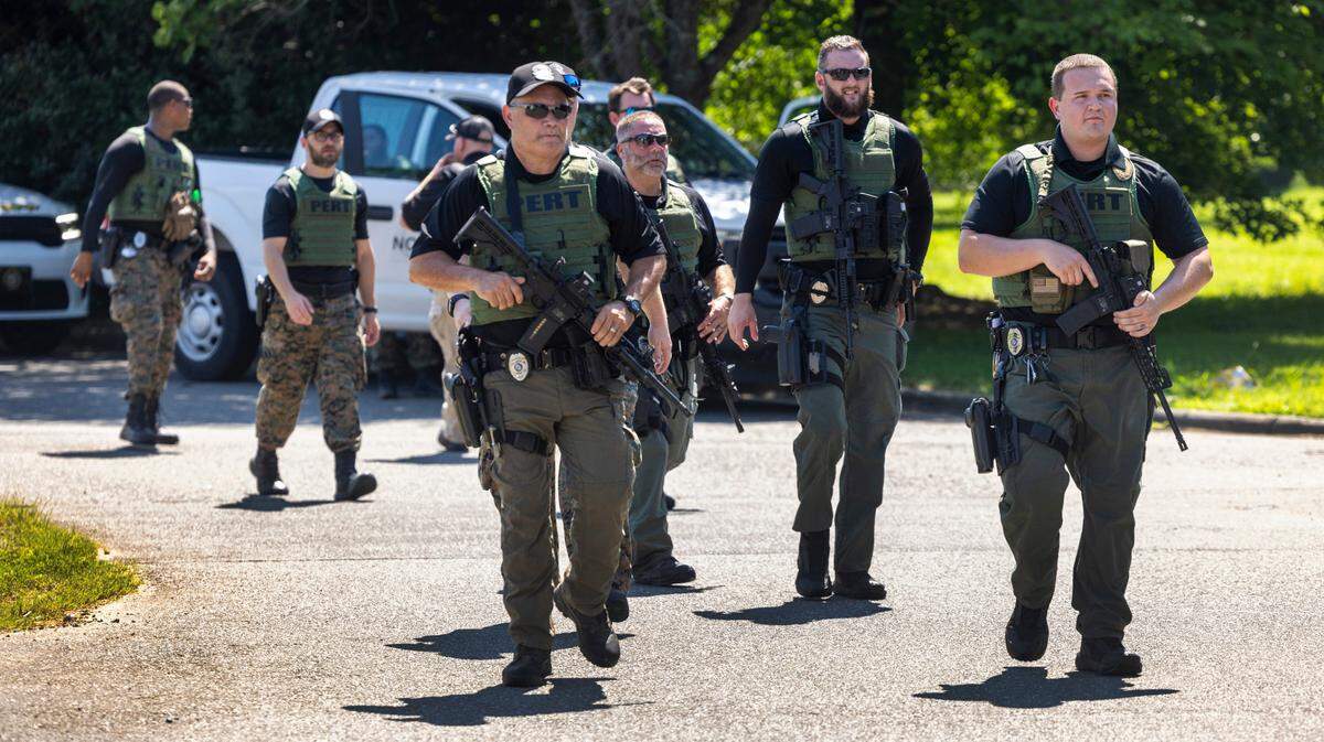Officers with the North Carolina Prison Emergency Response Team (PERT) search for escaped inmate Ramone Alston on Wednesday morning August 14, 2024 in Hillsborough, N.C. Alston, who was serving a life sentence for second degree murder, escaped on Tuesday morning at UNC Hospitals in Hillsborough as he was being transported from Bertie Correctional Institute to Hillsborough.