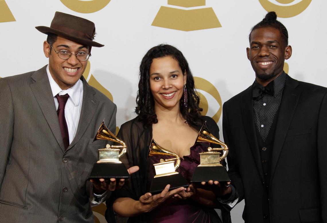 Carolina Chocolate Drops – Dom Flemons, Rhiannon Giddens and Justin Robinson – hold their Grammy Awards for best traditional folk album. They won the Grammy Award in 2010 for “Genuine Negro Jig.”