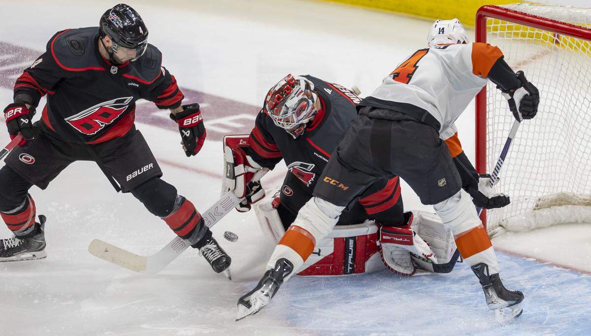 Carolina Hurricanes goalie Frederik Andersen (31) stops a scoring attempt by Philadelphia center Sean Couturier (14) in the third period of Game 1 on Saturday, May 2, 2026, during the second round of the Stanley Cup Playoffs at Lenovo Center in Raleigh, N.C.  Andersen stopped 19 shots on goal in the Hurricanes’ 3-0 victory.