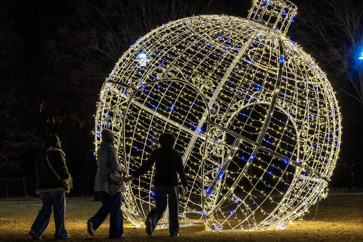 A giant walk-through Christmas ornament sits on the lawn outside the Martin Marietta Center for the Performing Arts on Saturday, Dec. 21, 2024. 