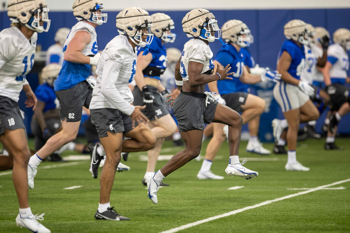 Duke wide receiver Sahmir Hagans (85) runs sprints with teammates during the Blue Devils’ spring practice on Friday, March 24, 2023 in Durham, N.C.