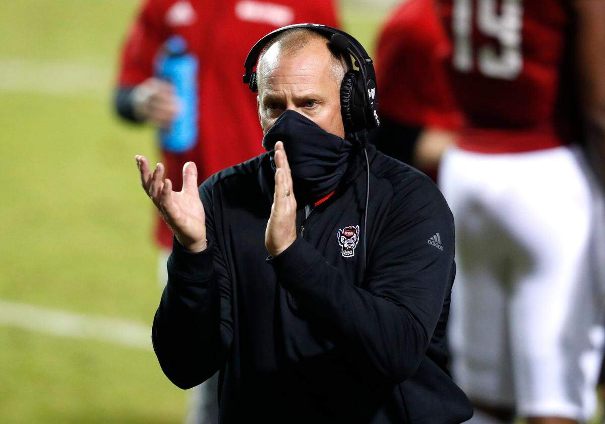 N.C. State head coach Dave Doeren encourages his team during the second half of N.C. State’s 15-14 victory over Liberty at Carter-Finley Stadium in Raleigh, N.C., Saturday, Nov. 21, 2020.