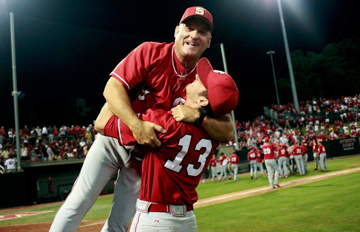 N.C. State’s Ryan Matthews hoists up head coach Elliott Avent following the Pack’s 9-7 win over Vanderbilt during the NCAA Baseball Raleigh Regional championship Monday, June 4, 2012.
