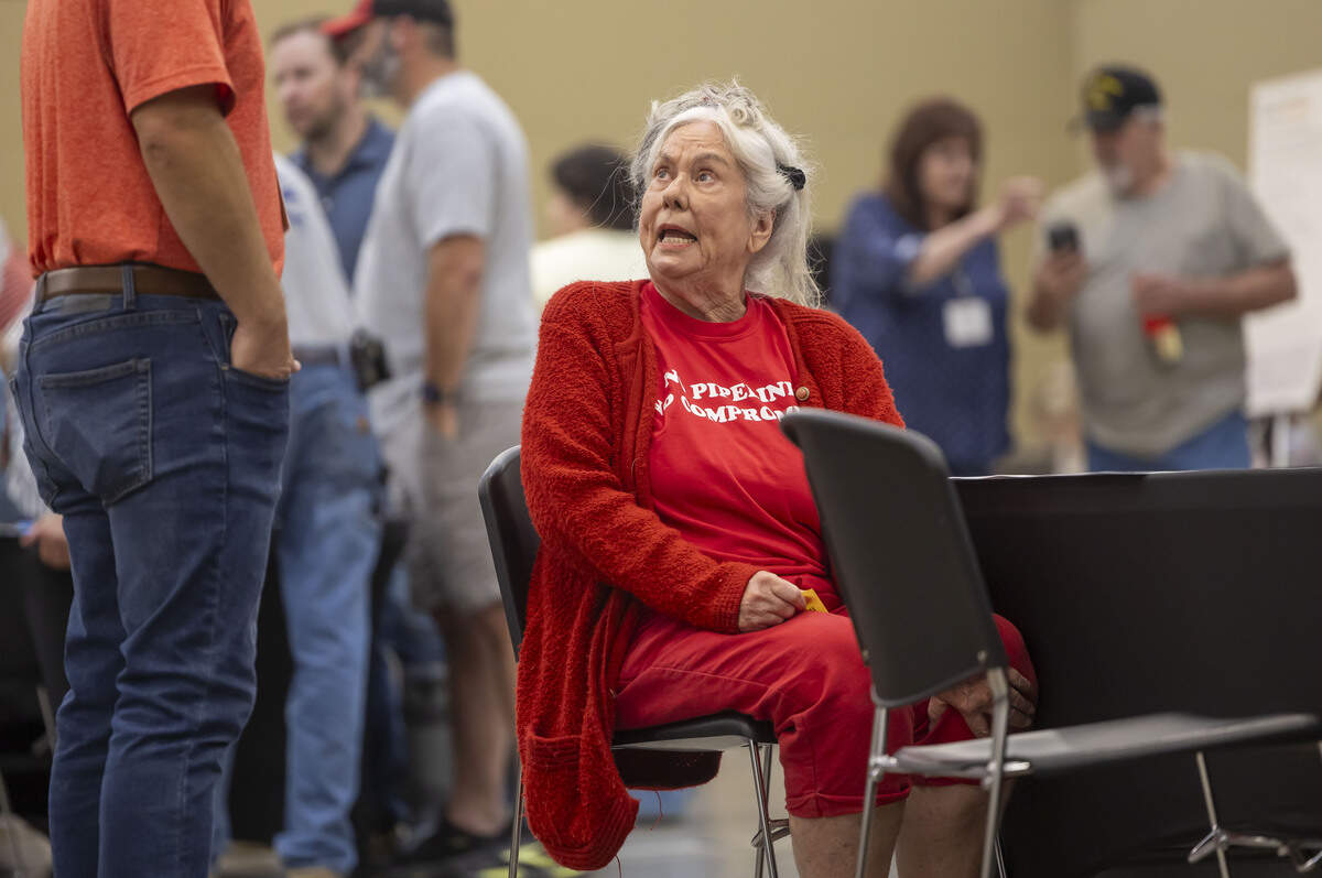 Chatham County property owner Dorasue Christian voices her concerns to an Enbridge employee, during an information session and open house regarding a proposed 28-mile natural gas pipeline, on Tuesday, July 28, 2026, at the Chatham County Agriculture & Conference Center in Pittsboro, N.C.