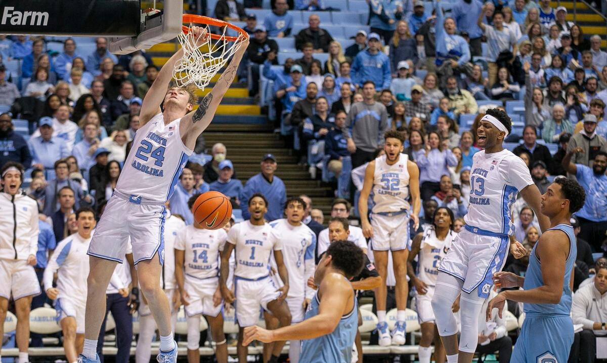 North Carolina’s Tyler Nickel (24) dunks on a fast break after making a steal from The Citadel’s Jackson Price (0) in the second half on Tuesday, December 13, 2022 at the Smith Center in Chapel Hill, N.C. Nickel came off the bench to lead North Carolina with 16 points in their 100-67 victory.