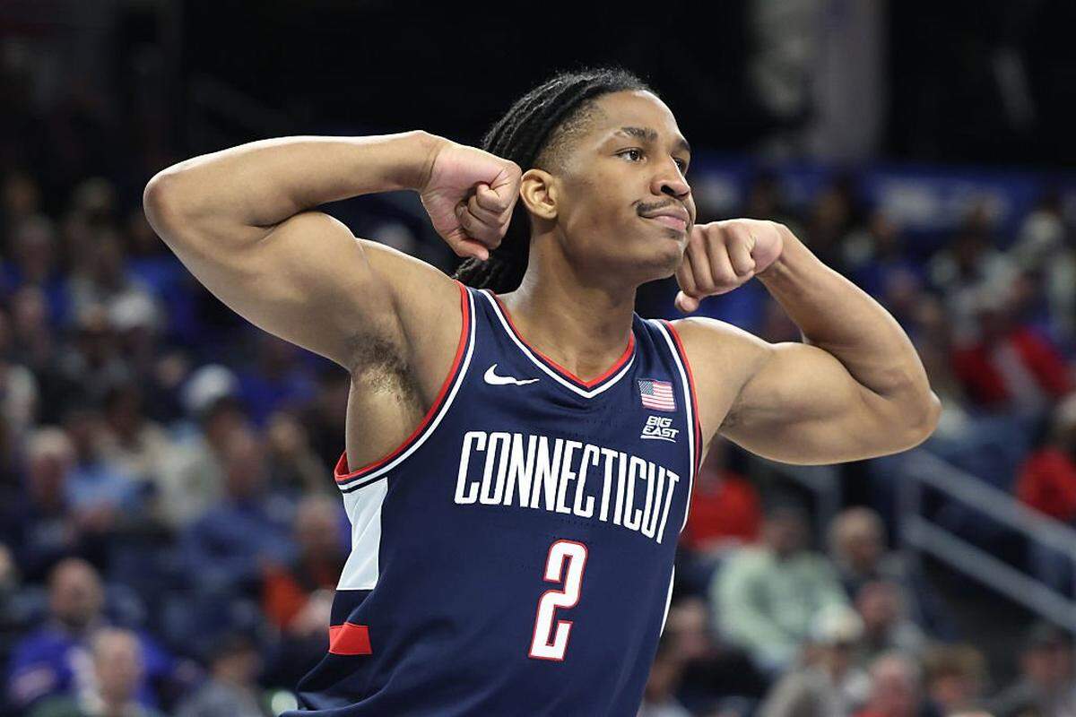 Silas Demary Jr. of the UConn Huskies celebrates scoring during the second half against the DePaul Blue Demons at Wintrust Arena on December 21, 2025 in Chicago, Illinois. 