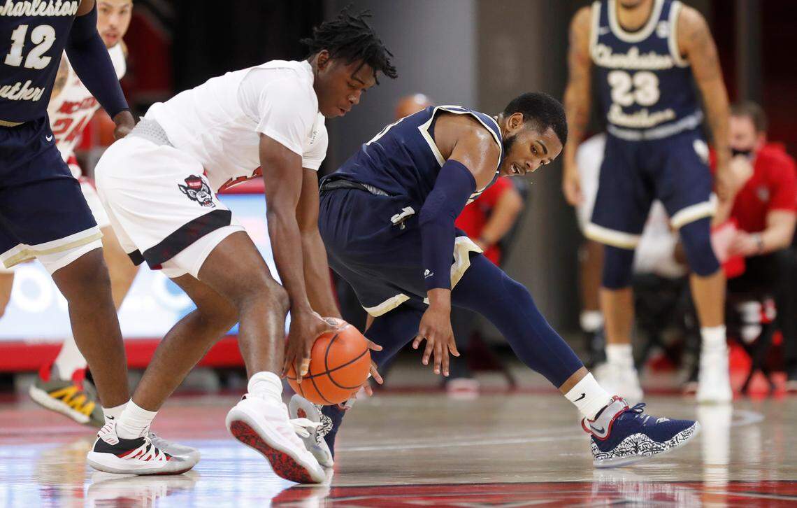 N.C. State’s Cam Hayes (3) steals the ball from Charleston Southern’s Travis Anderson (0) during the first half of N.C. State’s game against Charleston Southern in the Wolfpack Invitational at Reynolds Coliseum in Raleigh, N.C., Wednesday, Nov. 25, 2020.