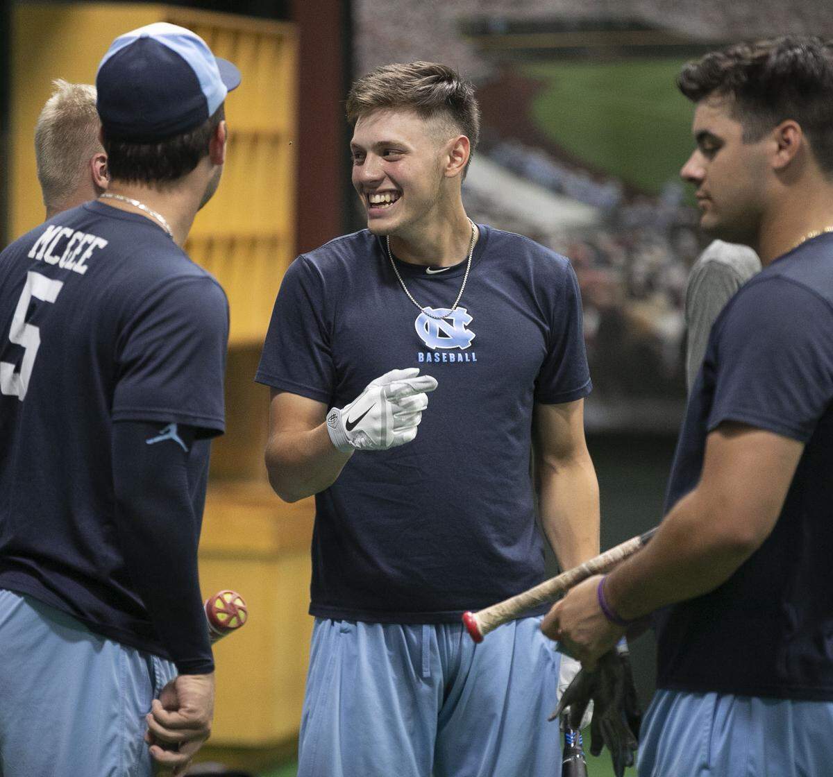 North Carolina’s Danny Serretti (1) talks with teammates Ike Freeman, Ashton McGee and Aaron Sabato as they wait their turns for batting practice at the Tar Heels indoor batting cage on Friday June 7, 2019 at Bosahmer Stadium in Chapel Hill, N.C. The Tar Heels were forced to move their practice for their NCAA Super Regional game against Auburn indoors after heavy rain moved into the area on Friday afternoon.