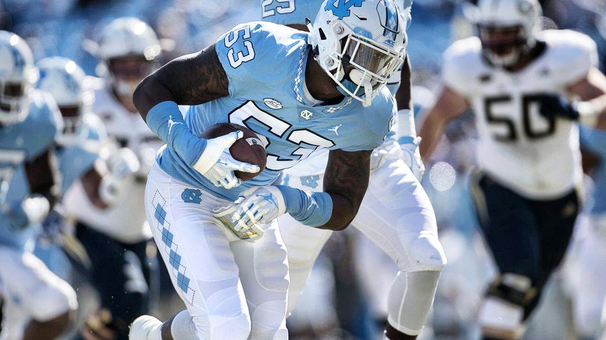 North Carolina Malik Carney (53) returns a Georgia Tech fumble 20 yards for a touchdown in the first quarter on Saturday, November 3, 2018 at Kenan Stadium in Chapel Hill, N.C.