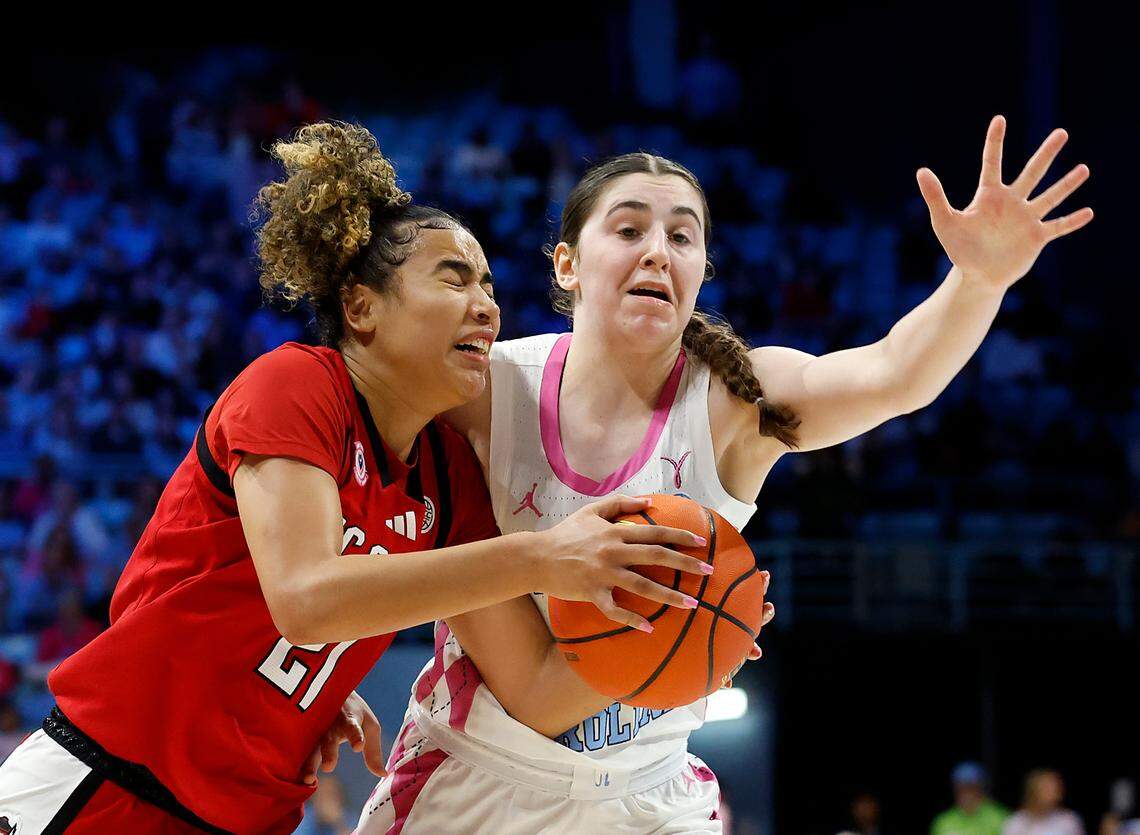 N.C. State’s Madison Hayes drives past North Carolina’s Lanie Grant during the second half of the Tar Heels’ 66-65 win on Sunday, Feb. 16, 2025, at Carmichael Arena in Chapel Hill, N.C.
