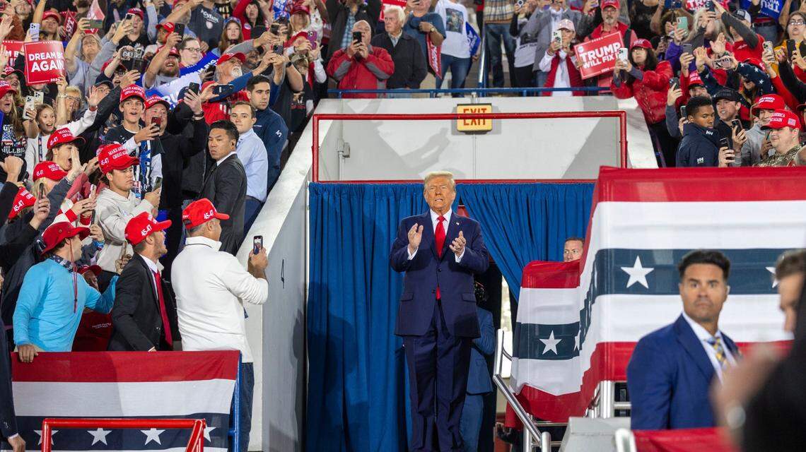 Republican presidential nominee and former President Donald Trump takes the stage during a rally at Dorton Arena in Raleigh on Monday, Nov. 4, 2024, one day before Election Day.