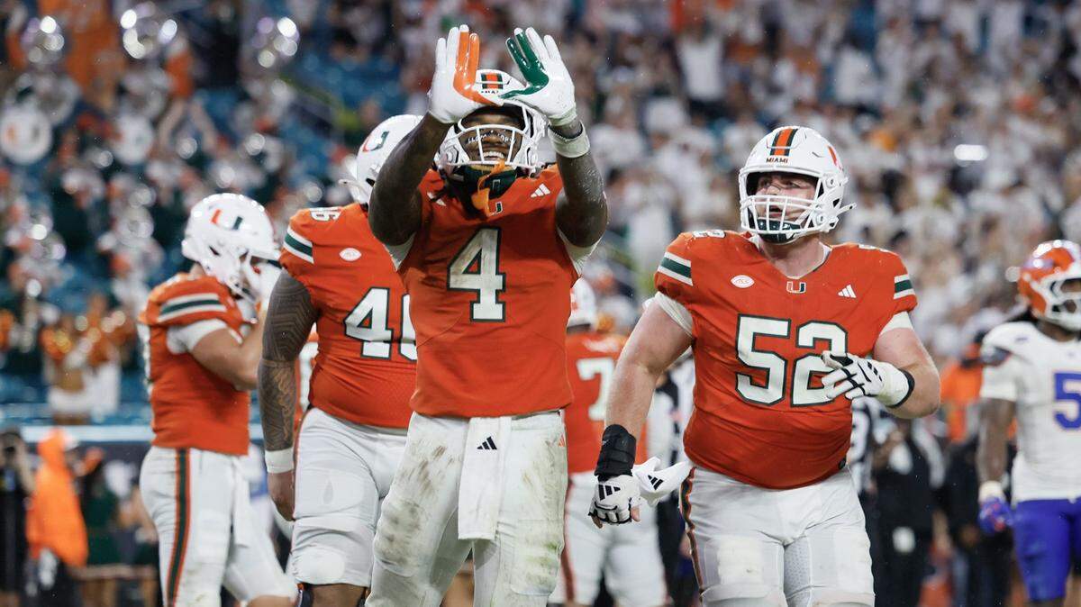 Miami Hurricanes running back Mark Fletcher Jr. (4) flashes the U after scoring in the second half of their NCAA football game against the Florida Gators at Hard Rock Stadium in Miami Gardens, Florida, on Saturday, September 20, 2025.