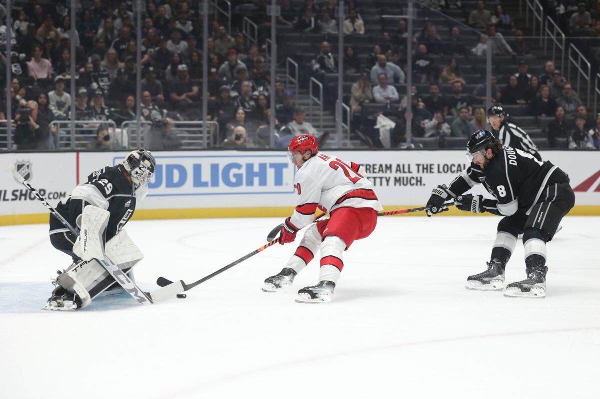 Oct 14, 2023; Los Angeles, California, USA; Carolina Hurricanes Center Sebastian Aho (20) scores a goal against Los Angeles Kings Goalie Pheonix Copley (29) during the first period at Crypto.com Arena. Mandatory Credit: Yannick Peterhans-USA TODAY Sports