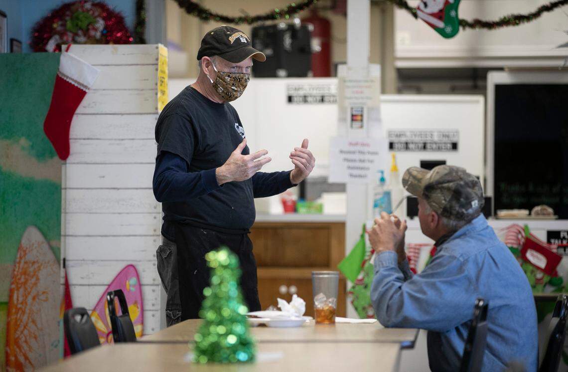 Bob Davis, the owner of the Nashville Diner, talks with a customer during the lunch hour on Wednesday, December 2, 2020 in Nashville, N.C. Davis and his staff take all of the necessary precautions to operate their business safely during the COVID-19 pandemic.