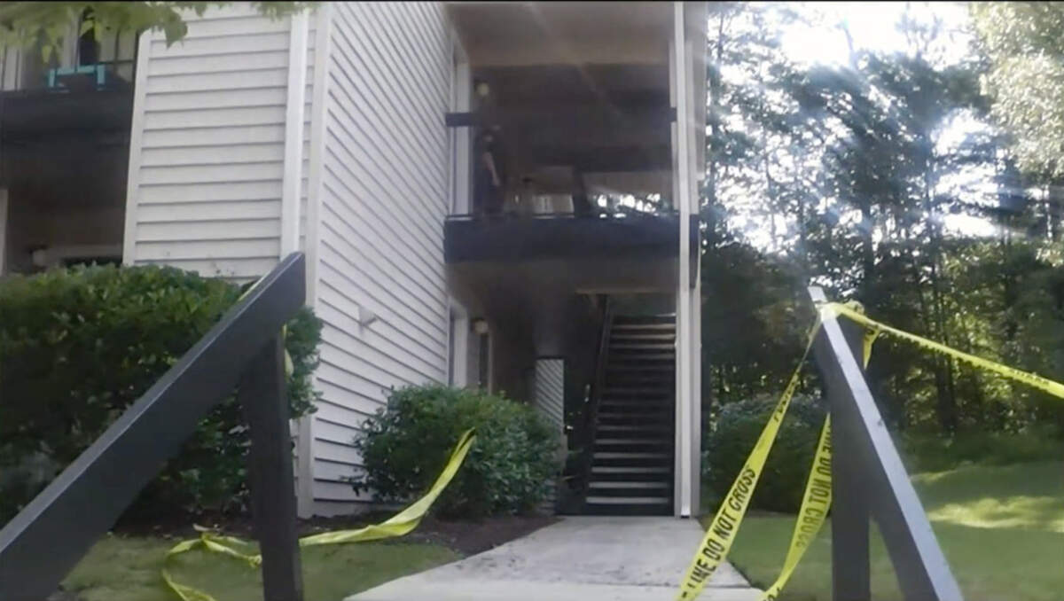 Outside apartment.jpg An image from an evidence video taken outside of the upstairs apartment where Faith Hedgepeth was beaten and murdered.
