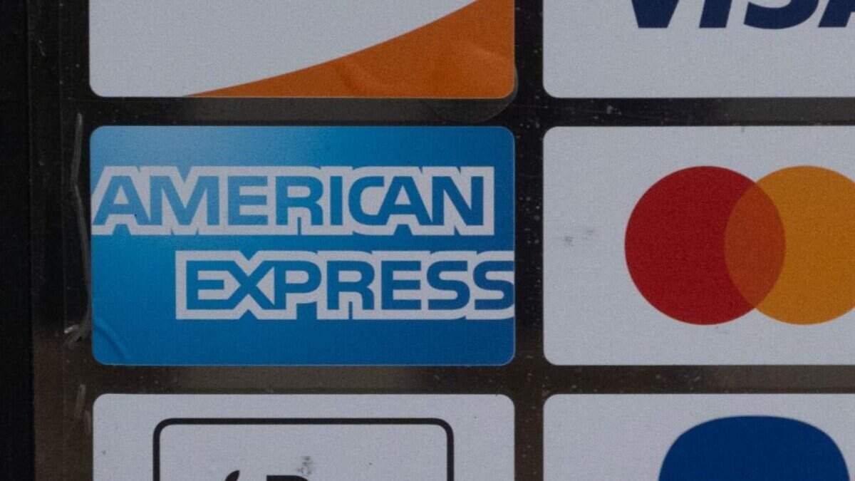 CHICAGO, ILLINOIS - FEBRUARY 11: A sticker shows that the American Express credit card is accepted at the front of a business on February 11, 2025 in Chicago, Illinois. (Photo by Scott Olson/Getty Images)