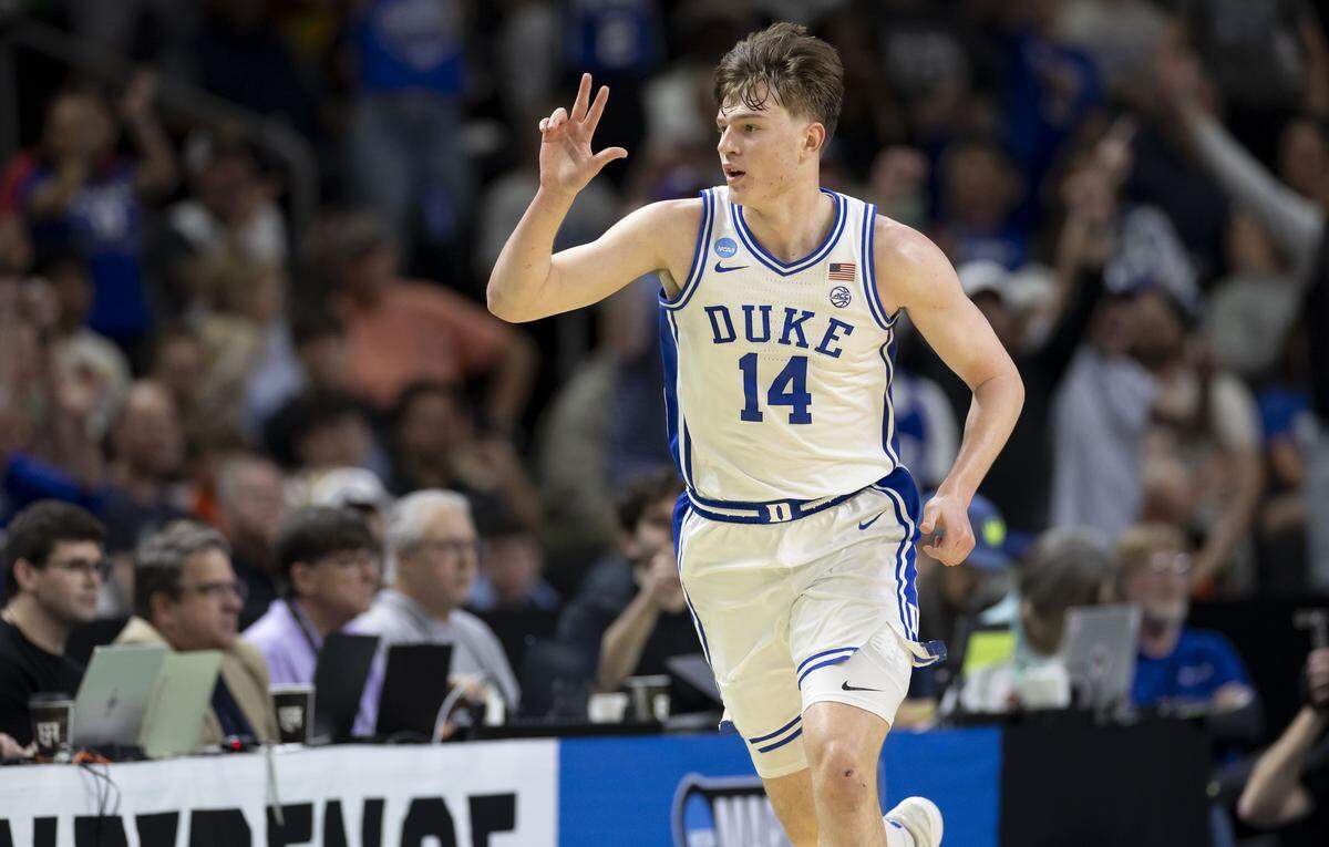 Duke guard Nikolas Khamenia (14) reacts after a three point basket in the second half against TCU on Saturday, March 21, 2026, during the second round of the NCAA Tournament at Bon Secours Arena in Greenville, S.C.