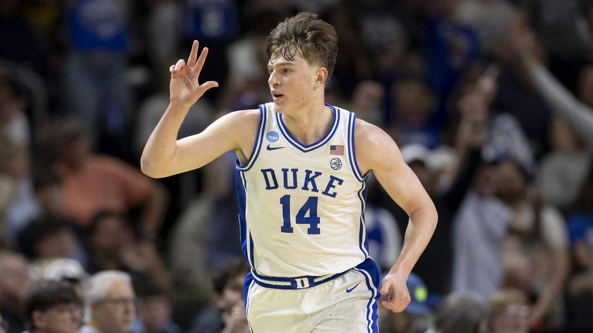 Duke guard Nikolas Khamenia (14) reacts after a three point basket in the second half against TCU on Saturday, March 21, 2026, during the second round of the NCAA Tournament at Bon Secours Arena in Greenville, S.C.