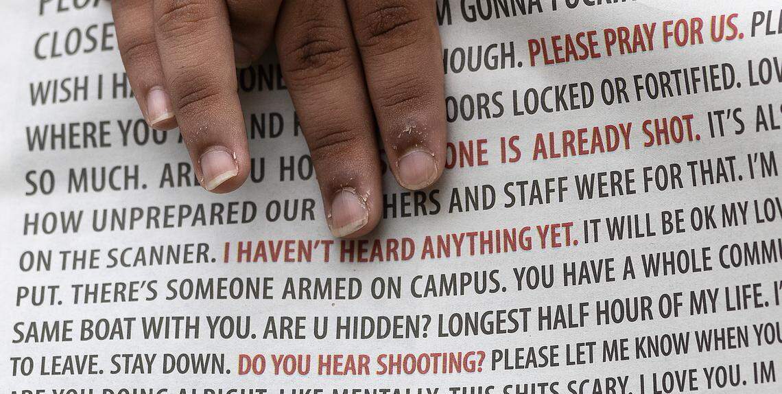 A person holds a copy of The Daily Tar Heel on the campus of UNC-Chapel Hill on Wednesday, Aug. 30, 2023. A graduate student has been charged with first-degree murder following a Monday shooting that left physics professor Zijie Yan dead on the university’s campus.
