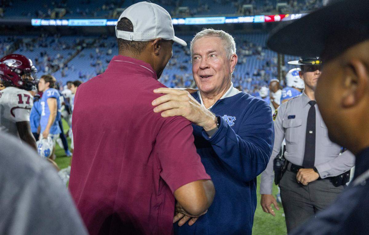 North Carolina Central University head coach Trei Oliver congratulates North Carolina coach Mack Brown following Tar Heels’ 45-10 victory on Saturday, September 14, 2024 at Kenan Stadium in Chapel Hill, N.C.