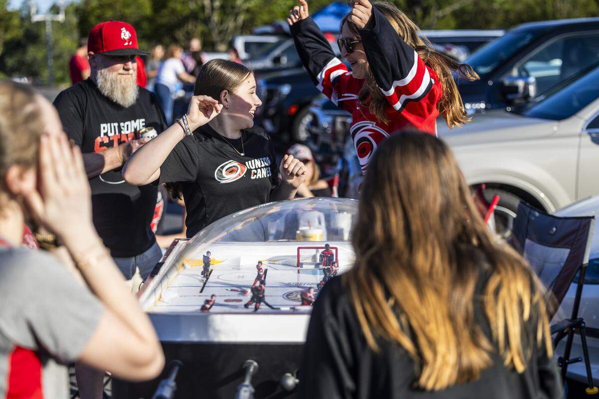 Carolina Hurricanes fans tailgate in the parking lot at the Lenovo Center in Raleigh on Tuesday, June 2, 2026, before Game 1 of the Stanley Cup Final. For the first time since 2006, the Hurricanes are playing in the Stanley Cup Final, facing the Vegas Golden Knights, who won the Stanley Cup in 2023.