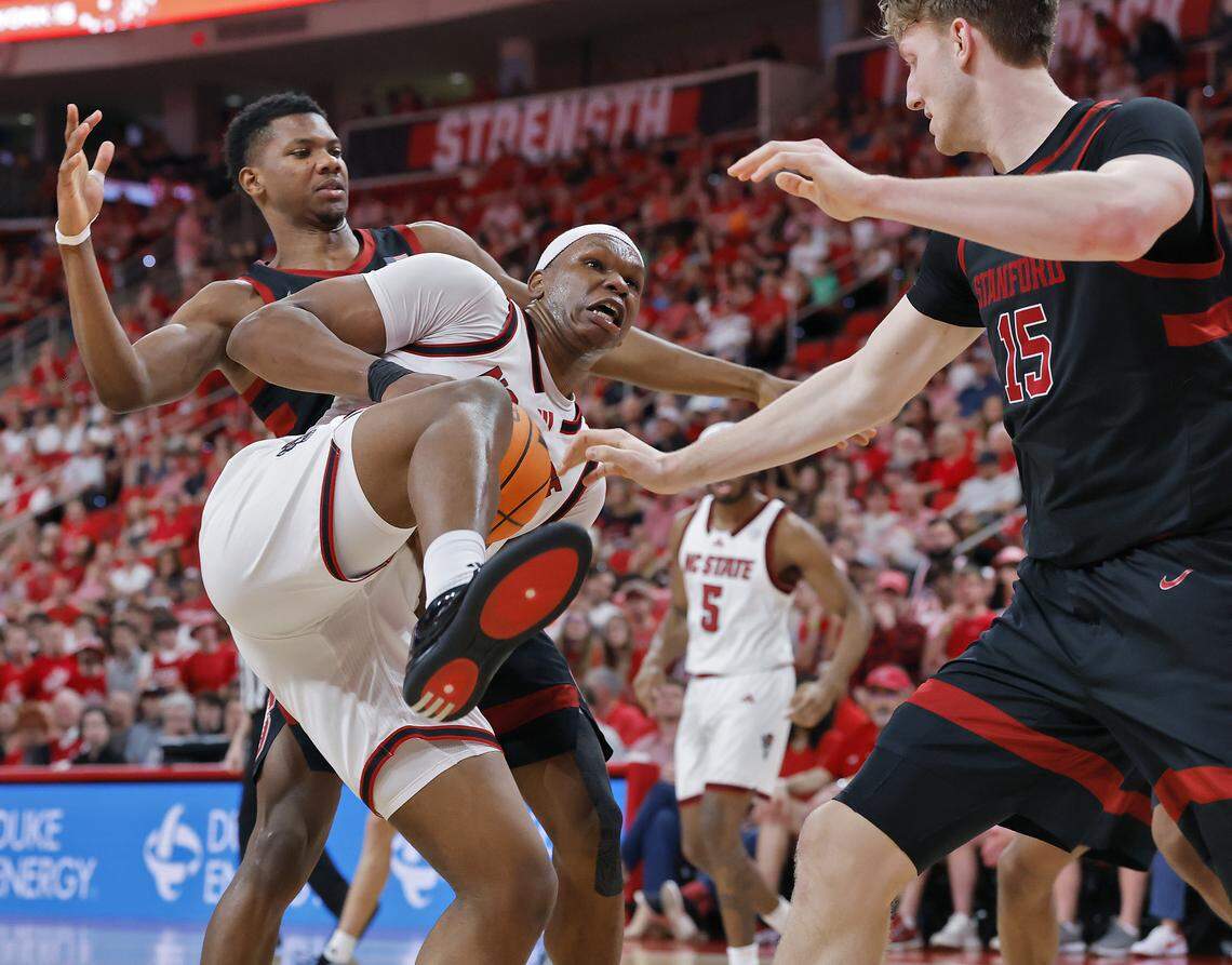N.C. State's Ven-Allen Lubin pulls down a rebound away from Stanford's Oskar Giltay during the first half of the Wolfpack’s 85-84 loss on Saturday, March 7, 2026, at Lenovo Center in Raleigh, N.C.