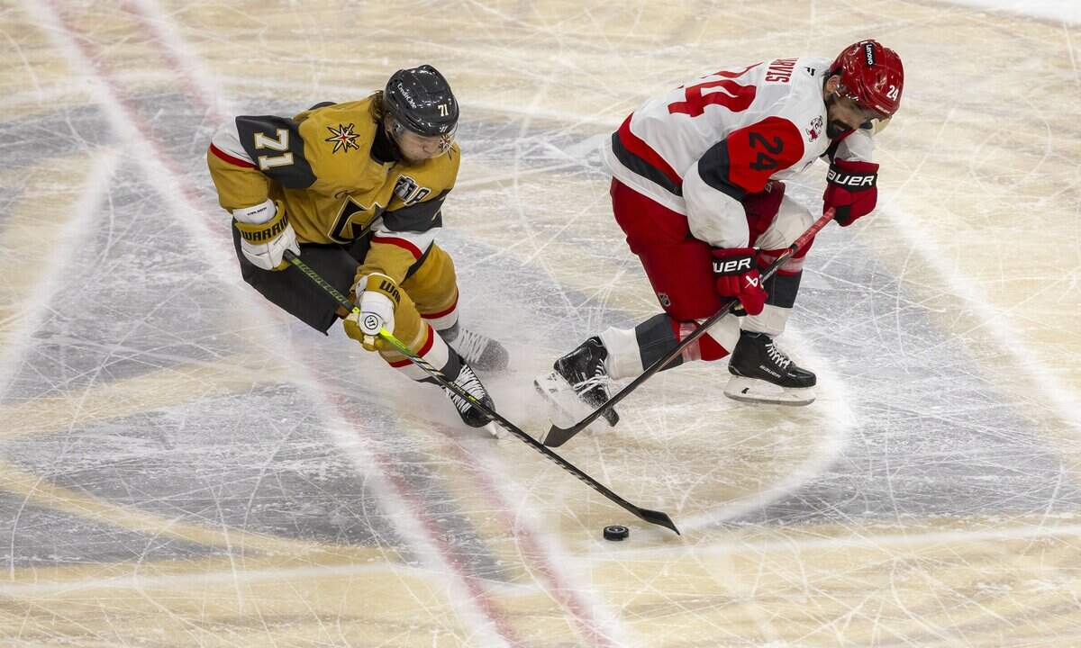 Vegas center William Karlsson (71) battles with Carolina Hurricanes right wing Seth Jarvis (24) for control of the puck in the first overtime period in Game 3 of the Stanley Cup Final, on Saturday, June 6, 2026 at T-Mobile Arena in Las Vegas, NV.
