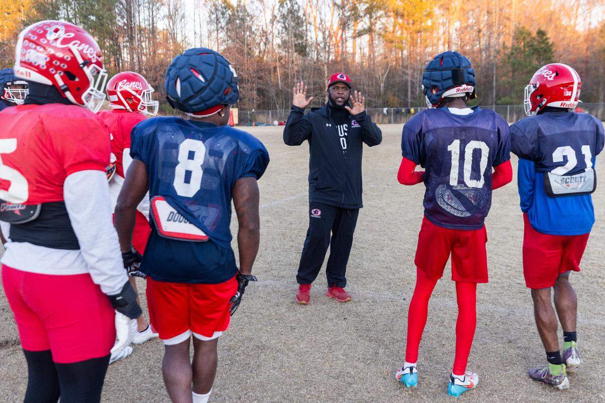 Louisburg College Head Football Coach Quinderra Spellman leads his team during their final practice on Tuesday, Dec. 3, 2004, in Louisburg. The team is heading to the NJCAA National Championship for the first time in the program’s 20-year history.