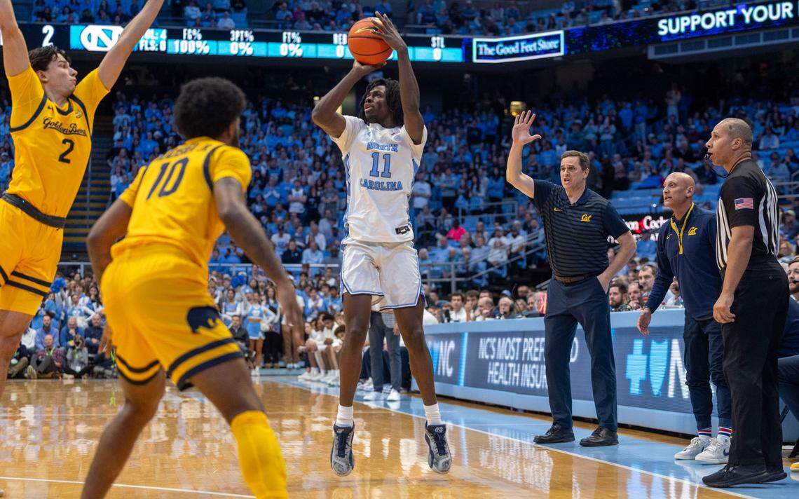 North Carolina guard Ian Jackson (11) launches a three-point shot against Cal’s Andrej Stojakovic (2) in the first half on Wednesday, January 15, 2025 at the Smith Center in Chapel Hill, N.C.
