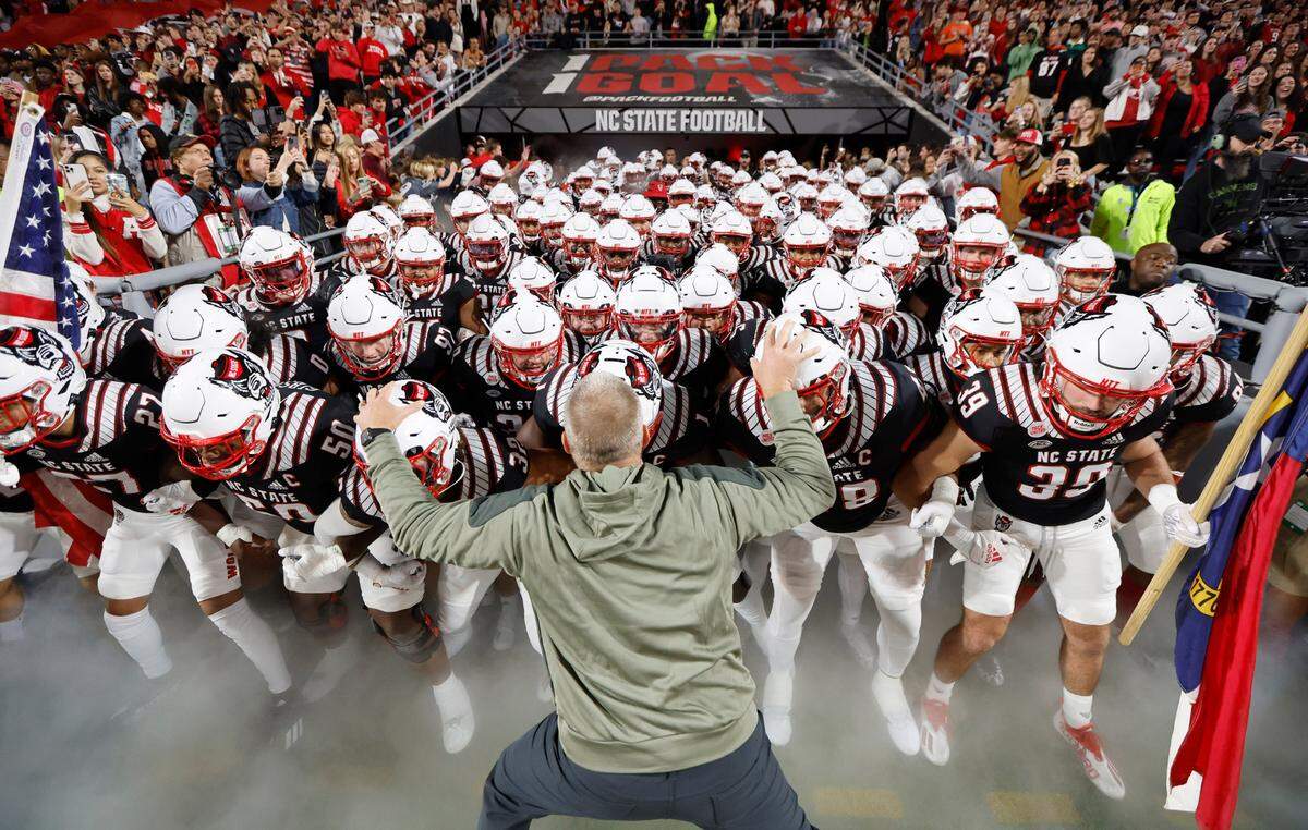 N.C. State head coach Dave Doeren prepares to lead his team out onto the field before N.C. State’s game against Virginia Tech at Carter-Finley Stadium in Raleigh, N.C., Thursday, Oct. 27, 2022.