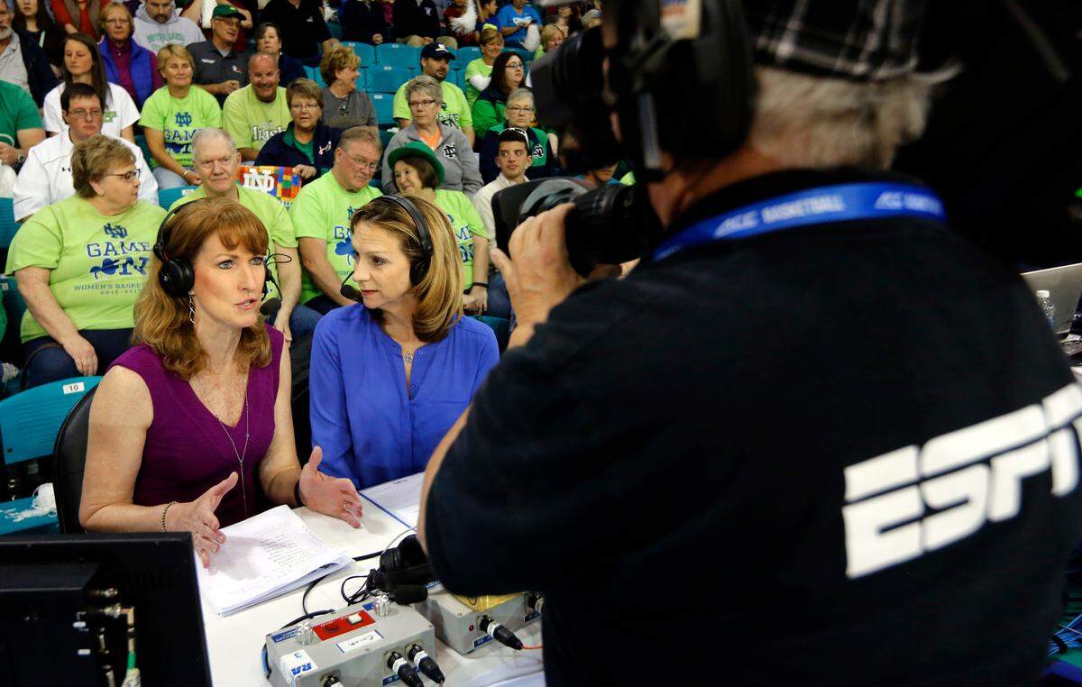 Debbie Antonelli, left, a basketball analyst for ESPN, talks with announcer Beth Mowins, right, before the start of the ACC women’s title game in 2017.