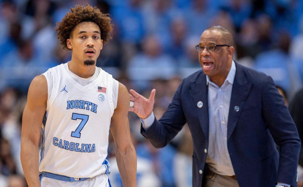 North Carolina guard Seth Trimble (7) enters the game against SMU and gets instructions from coach Hubert Davis on Tuesday, January 7, 2025 in Chapel Hill, N.C.