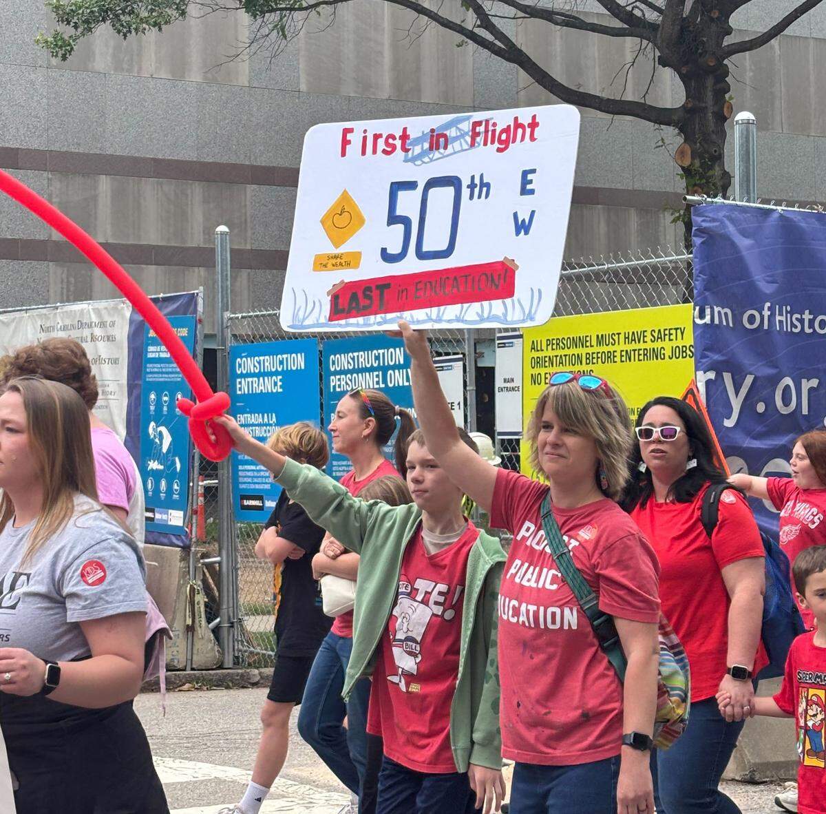Teachers and supporters march through downtown Raleigh, May 1, 2026.