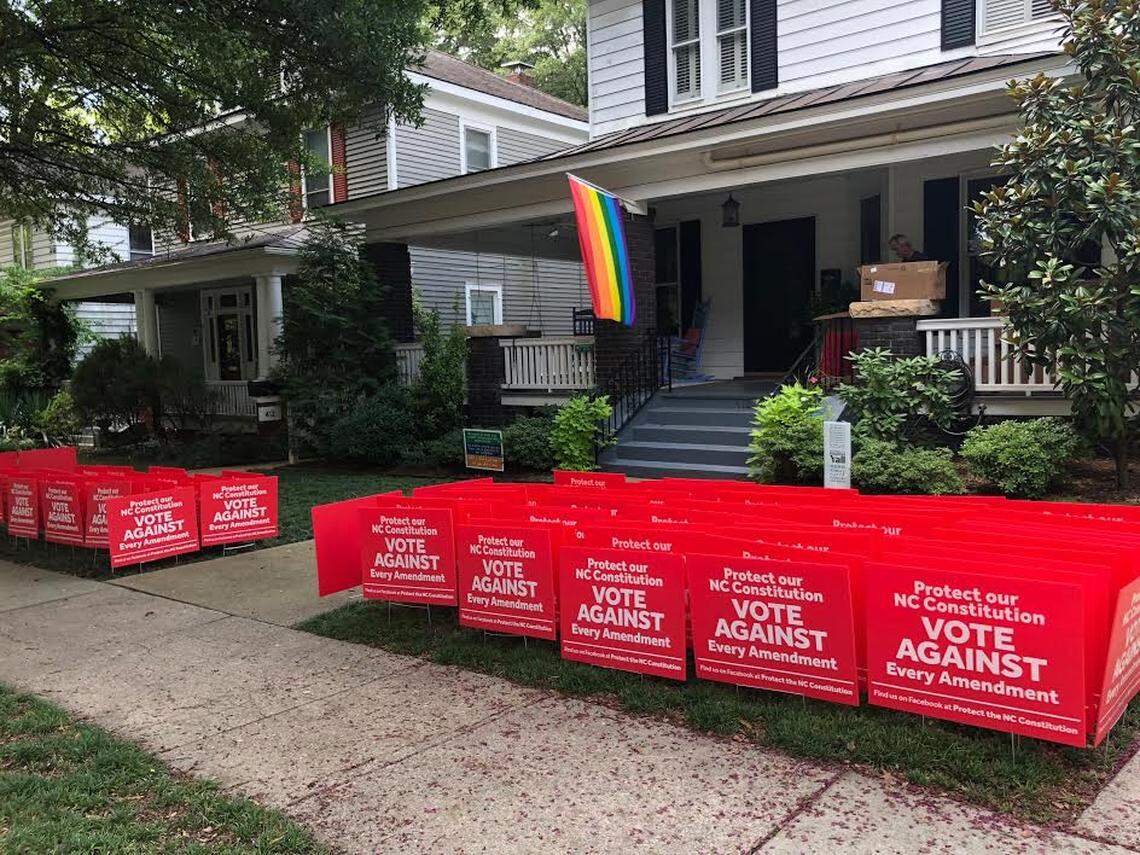 Chris Weedy and Jimmy Creech are offering signs from their Raleigh home urging people to vote against all six constitutional amendments in the November midterm elections in North Carolina.