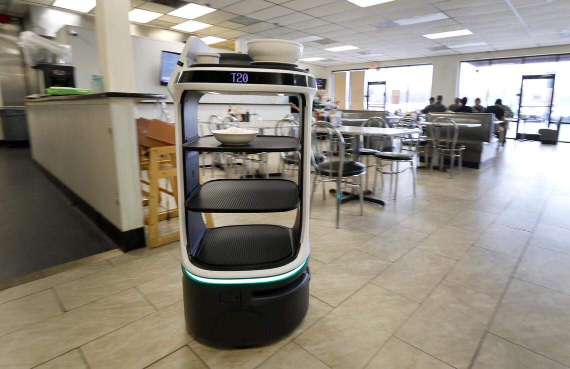 A robot delivers an order to lunchtime guests at Pho 919 in Morrisville.
