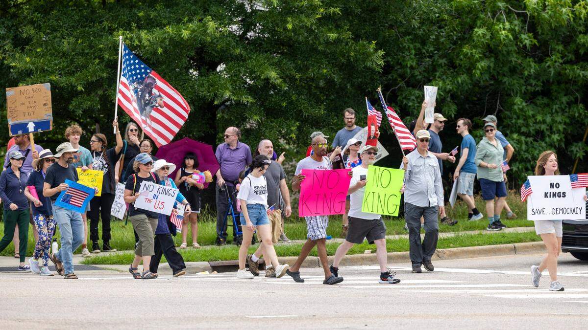 More than 1500 demonstrators lined Capital Boulevard to protest the policies and tactics of the of President Donald Trump on Saturday, June 14, 2025 near Triangle Town Center in Raleigh. The Raleigh “No Kings” rally was one of dozens across North Carolina and hundreds nationwide on what organizers called a nationwide day of defiance against the Trump administration.