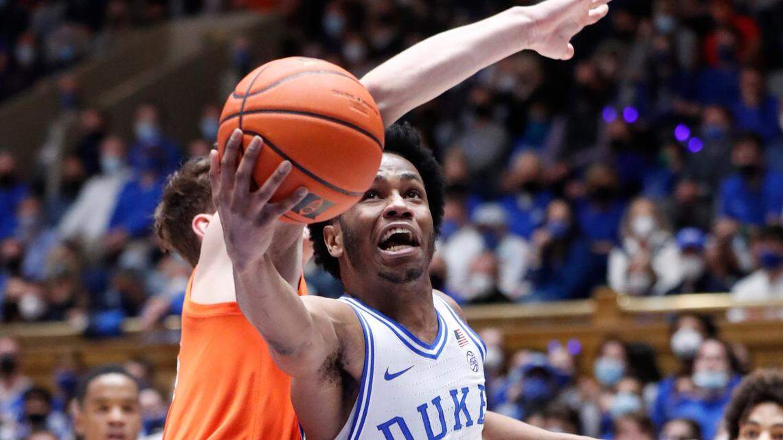 Duke’s Jeremy Roach (3) shoots as Clemson’s Ben Middlebrooks (10) defends during a game in Durham on January 25, 2022. Roach and the Blue Devils will face Ohio State at Cameron Indoor Stadium in the ACC/Big Ten Challenge.