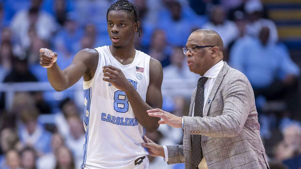 North Carolina coach Hubert Davis confers with forward Caleb Wilson (8) in the first half against N.C. Central on Friday, November 14, 2025 at the Smith Center in Chapel Hill, N.C.

