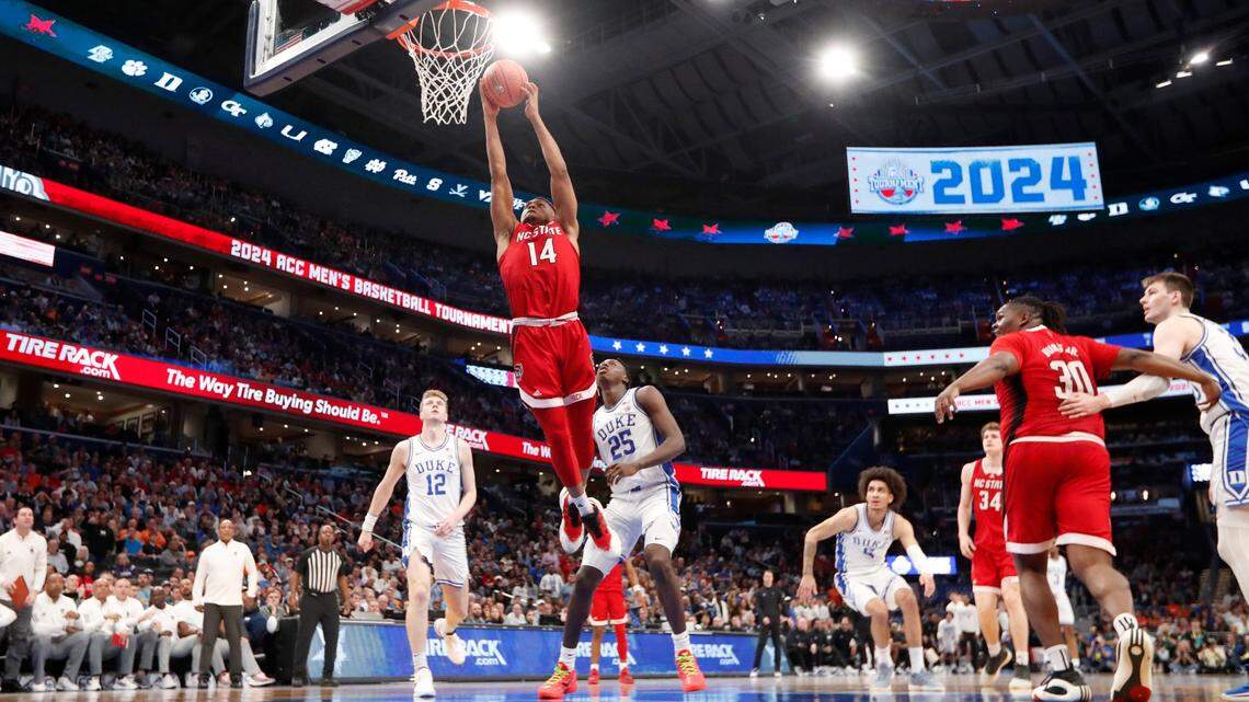 N.C. State’s Casey Morsell (14) heads to slam in two during N.C. State’s 74-69 victory over Duke in the quarterfinal round of the 2024 ACC Men’s Basketball Tournament at Capital One Arena in Washington, D.C., Thursday, March 14, 2024.