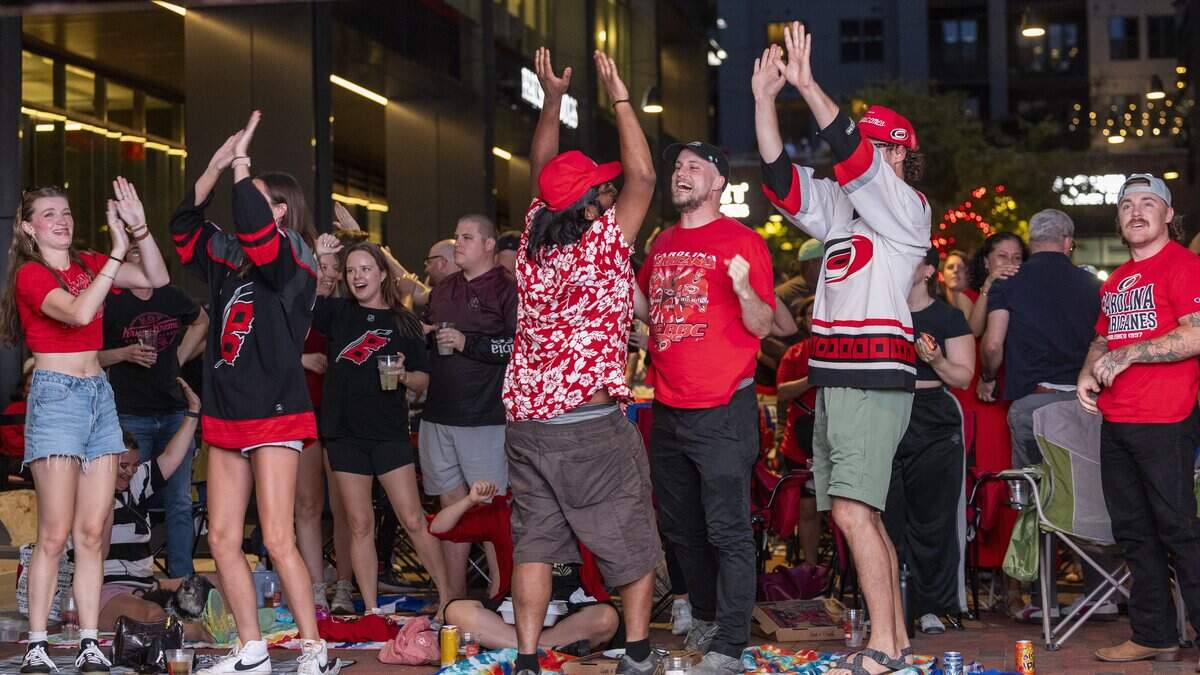 Carolina Hurricanes fans react during a Stanley Cup Final watch party in Raleigh's Smoky Hollow district on Tuesday, June 9, 2026, as the Hurricanes play the Vegas Golden Knights in Game 4 of the Stanley Cup Final.