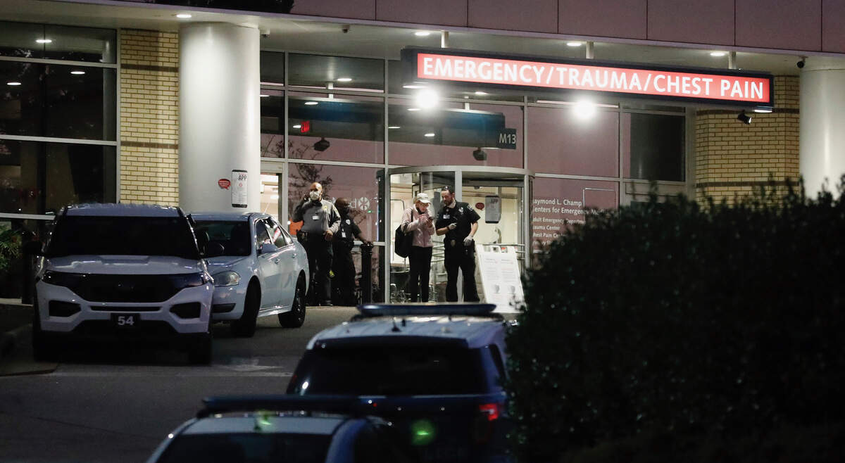 Officials stand outside WakeMed in Raleigh, N.C., Thursday, Oct. 13, 2022.