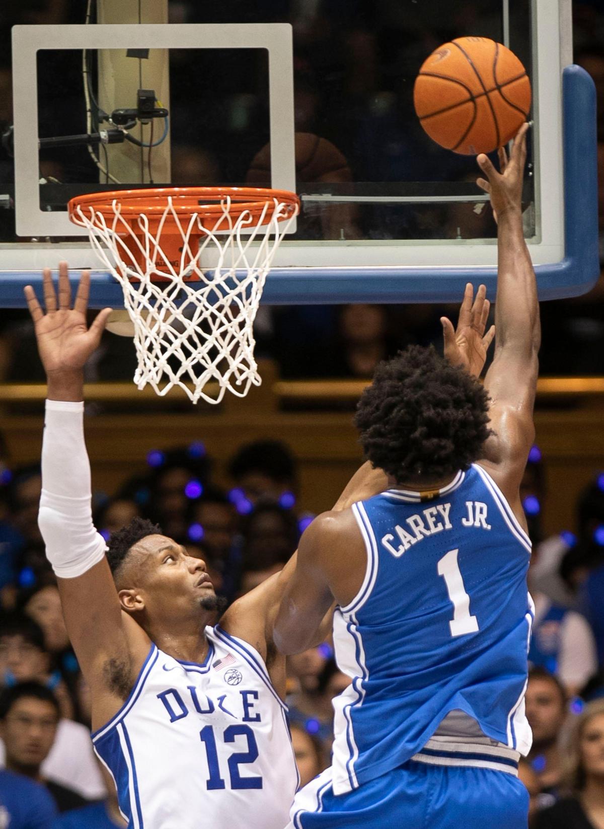 Duke’s Vernon Carey Jr. (1) puts up a shot over Javin DeLaurier (12) during the Blue Devils’ scrimmage at the annual Countdown to Craziness on Friday, October 18, 2019 at Cameron Indoor Stadium in Durham, N.C.